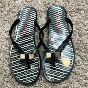 Coach Black Jelly Flip Flops with Gold Bow Accents sz 7.5
